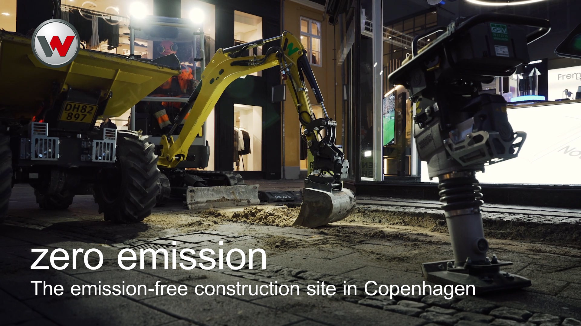 rammer dumper and excavator standing in the streets at night time